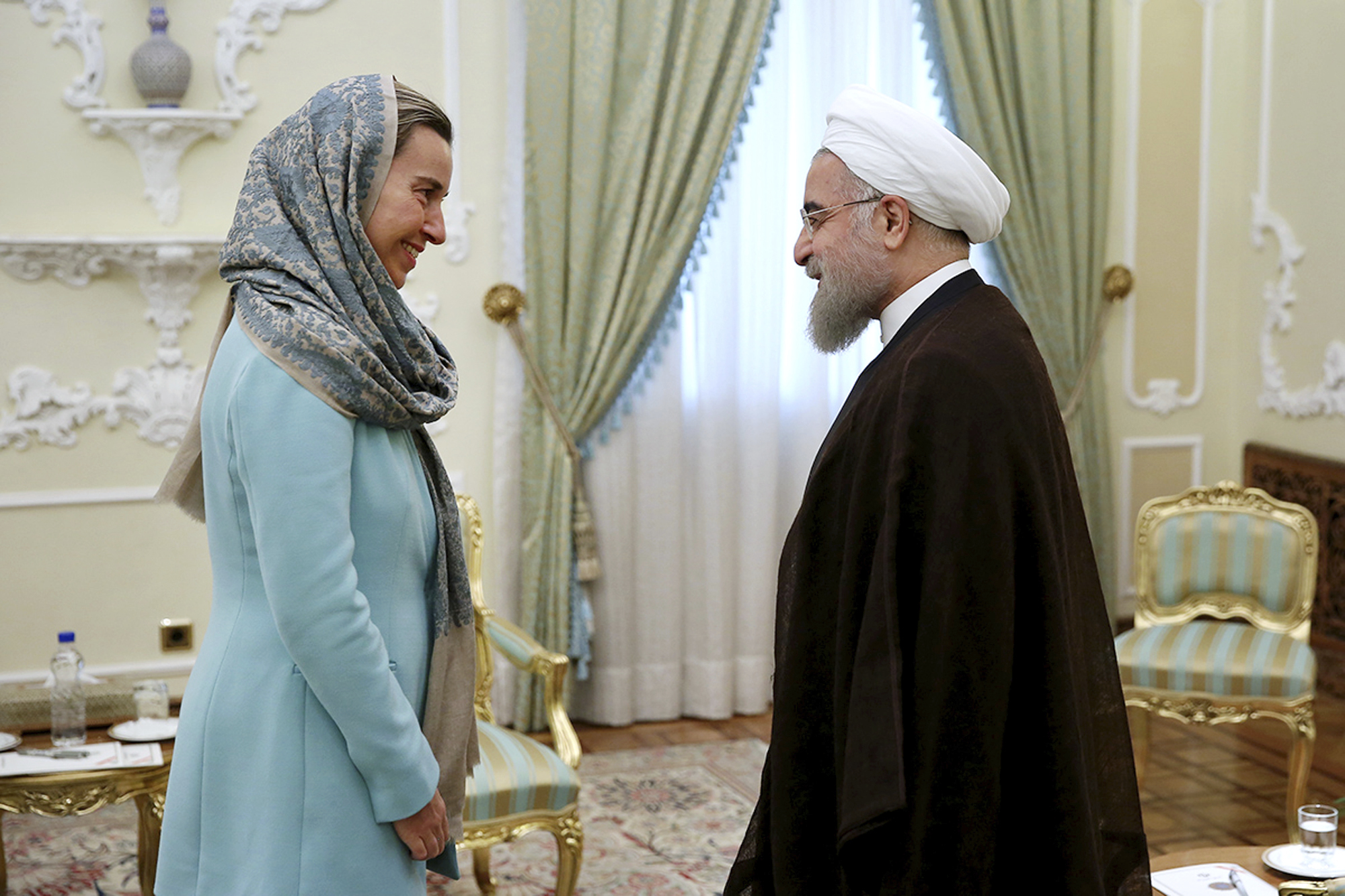EU foreign policy chief Federica Mogherini meets with Iranian President Hassan Rouhani just following adoption of the Iran Nuclear Deal (the “JCPOA”), which European corporations vainly hoped would spark a “gold rush” of business with the Islamic Republic.