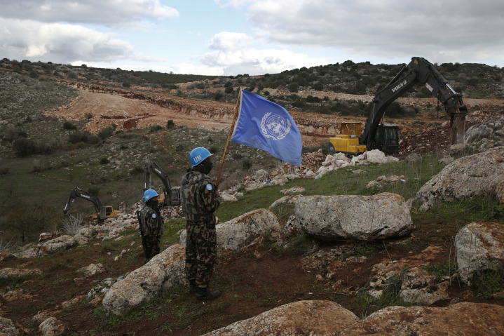 Members of UNIFIL, the U.N. peacekeeping force in Lebanon, watch as Israeli construction equipment destroys Hezbollah tunnels dug under the noses of these U.N. troops in violation of two U.N. Security Council Resolutions. U.N. member states fund UNIFIL with $475 million dollars annually.