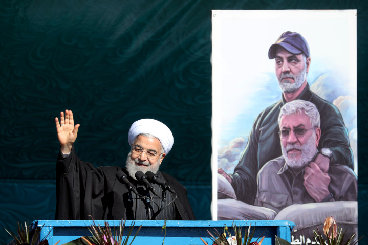 Iranian President Hassan Rouhani beams next to a photo of his henchman, Iranian Major General Qassem Soleimani and Iraqi Shi’ite militia commander Abu Mahdi al-Muhandis—both killed by a U.S. missile. Rouhani is happy a U.N. arms embargo will end in October, but the U.S. is determined to renew the embargo.