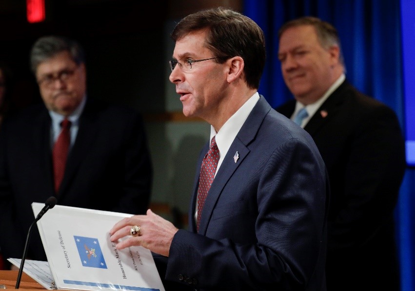U.S. Secretary of Defense Mark Esper, flanked by Attorney General William Barr (l) and Secretary of State Mike Pompeo (r), during a briefing on the U.S. decision to enact economic and travel restrictions on members of the International Criminal Court for their unauthorized investigation of U.S. military and intelligence operations in Afghanistan.