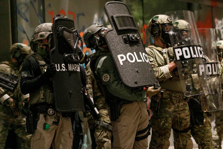 Police gather to quell a Black Lives Matter-led riot at the Portland federal court house. Black Lives Matter and anti-Israel groups promote a boycott of police training exchanges between the U.S. and Israel using false accusations against the Jewish state.