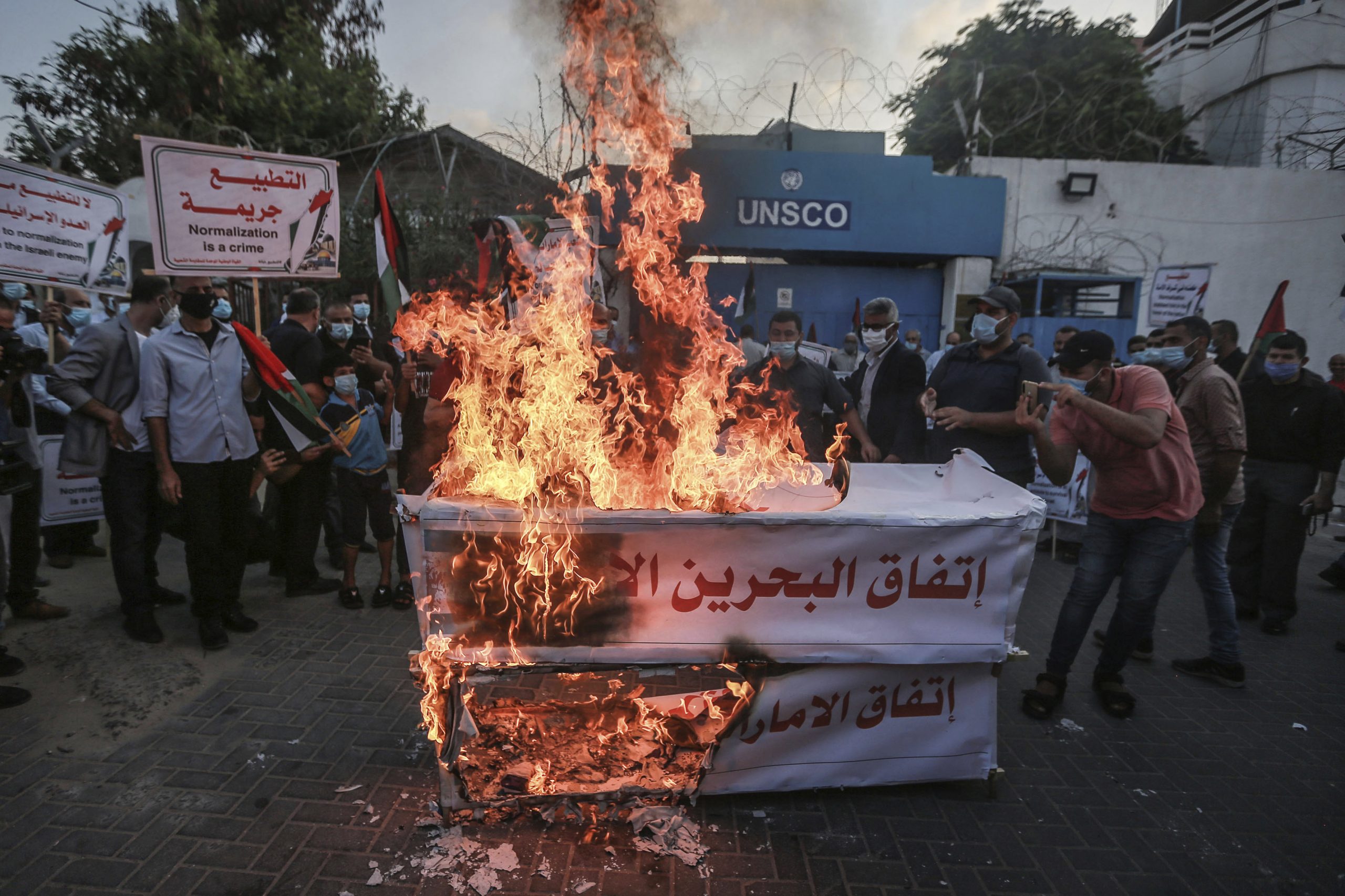 Palestinians in Gaza protest peace between Arab states and Israel in front of the office of the UN Special Coordinator for the Middle East Peace Process (UNSCO). Signs say “UAE and Bahrain agreement is occupation" and “Normalization is betrayal.” Palestinians are among the most vocal opponents of warming relations between Arabs and Jews.