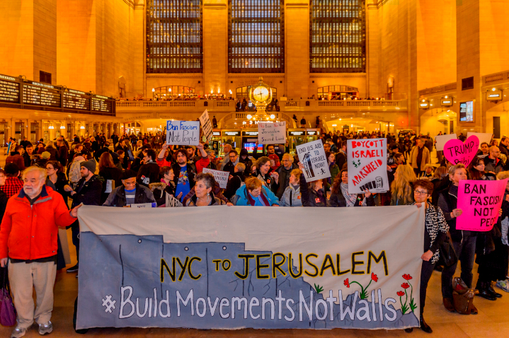 Many American Jews actively criticize Israeli policies, such as this protest against Israel’s security barrier led by Jewish Voice for Peace in Grand Central Station—yet they often ignore looming threats to the survival of American Jewry. 