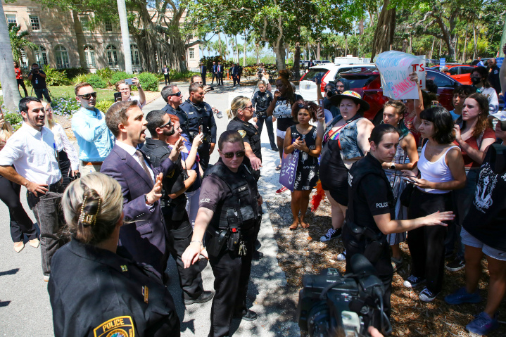 New College of Florida Trustee,Christopher Rufo, calms protesters following legislation blocking public colleges from using federal or state funding for Diversity, Equity and Inclusion (DEI) programs, most based on antisemitic critical race theory.