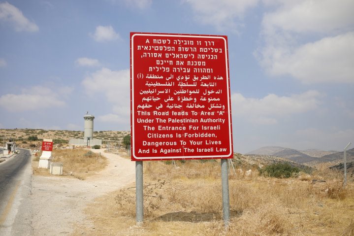 A sign on the road leading from Area C, near Bardala in the Jordan Valley in Judea-Samaria, to Palestinian-controlled Area A. The sign warns that Israeli citizens may not enter Area A as it is against Israeli law and “dangerous to your lives.”