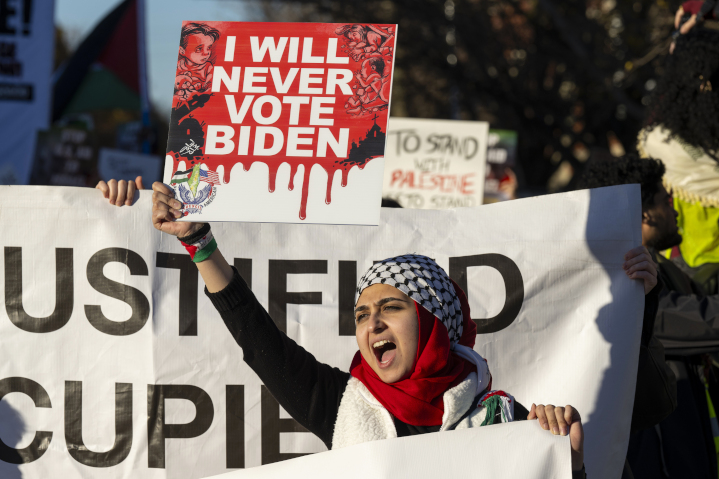 Protestor carrying a sign promising not to vote for Biden. Desperate to court Arab and Muslim voters, many of whom support Hamas terrorism, Biden has taken initiatives that favor Palestinians, risking alienation of a vast majority of American voters who oppose terror groups.