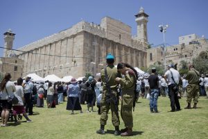 Israeli soldiers outside the Tomb of the Patriarchs in Hebron, Judea 