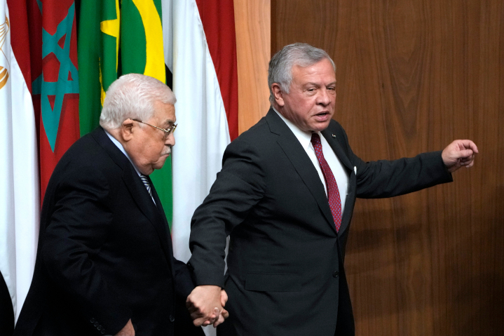 Jordan’s King Abdullah, right, guides 87-year-old Palestinian President Mahmoud Abbas off stage at a meeting in Cairo. Neither Abbas nor his predecessor Yasser Arafat proved capable of moving beyond terrorist violence against Jews to instead create inspiring national values and institutions.
