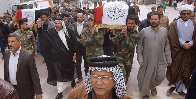Ad 173 mainvisual An Iran-backed Shiite militia, Popular Mobilization Forces, mourns two militants killed in U.S. airstrikes following deadly attacks on American and British bases near Baghdad, Iraq. Iran uses proxy militias throughout the Middle East to strike U.S. and Israeli assets.
