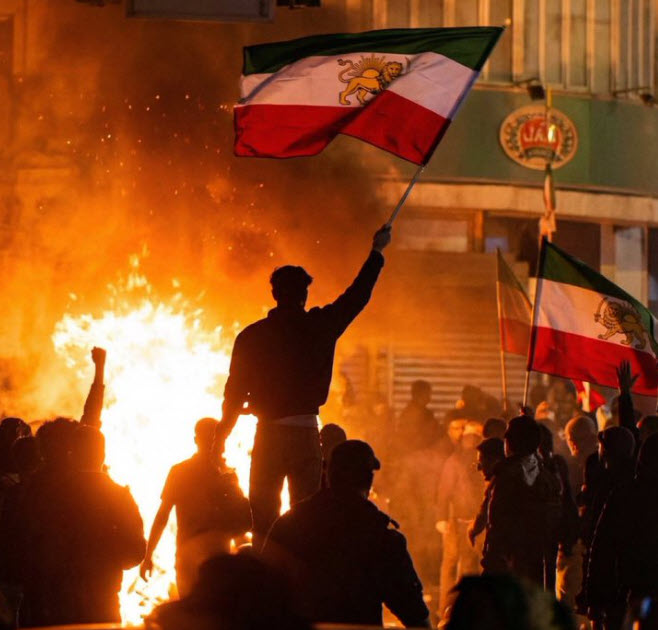 Iranian protesters fly the pre-Islamic Revolution Iranian flag. The same legacy media and human rights activists who so sharply criticized Israel for defending itself from Hamas now fall stone silent as Iran’s brutal Islamist regime murders its citizens for demanding freedom.